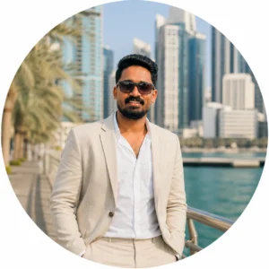 a guy in coat & suit looking forward in DUBAI